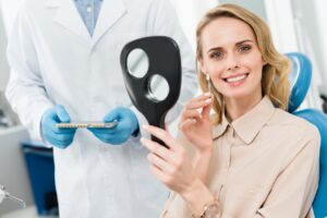 Female patient choosing tooth implant