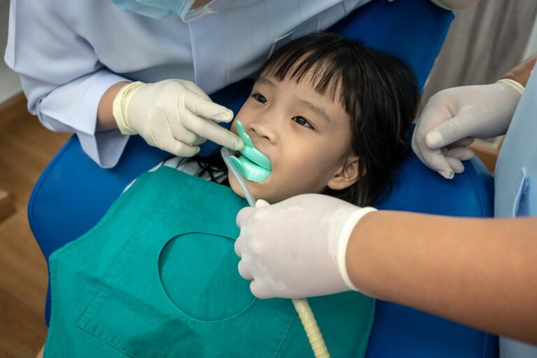 girl biting silicon tray of Fluoride