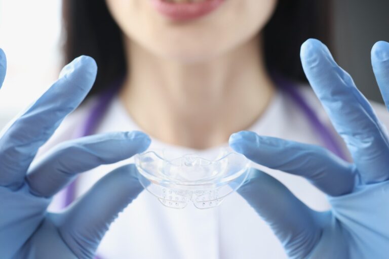 Dentist doctor holding mouth guard