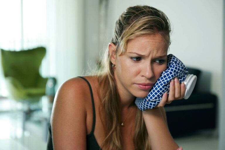 Young hispanic girl with toothache and dental problems
