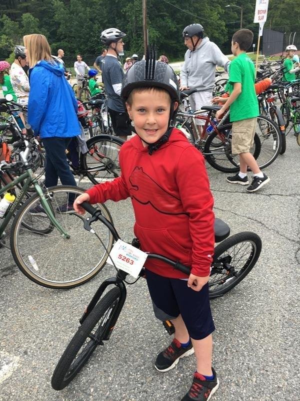 Dr. Anne Hertzberg joins Max at the Bedford Pan Mass Challenge Kids Day to raise money for cancer research.