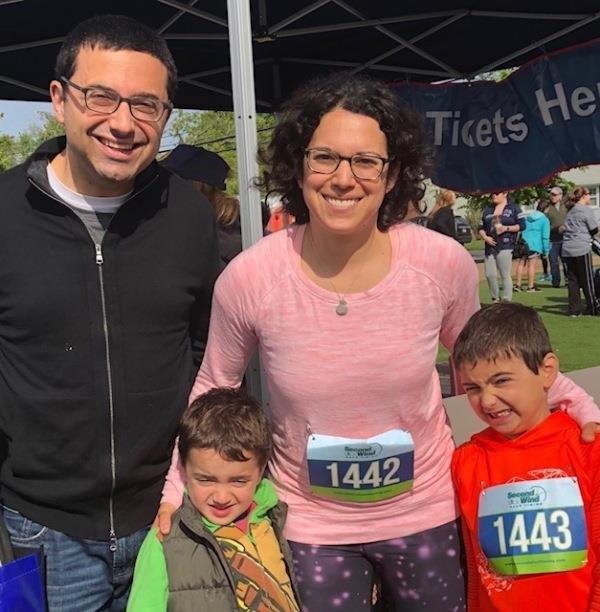 Dr. Amy Regen with her family running her first half marathon as part of Team Challenge fundraising for the Crohn's and Colitis Foundation of America.
