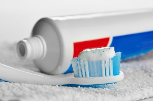 toothpaste on tooth brush