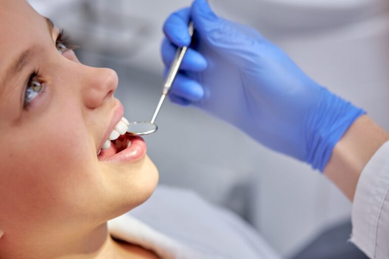 Adolescent girl dental exam